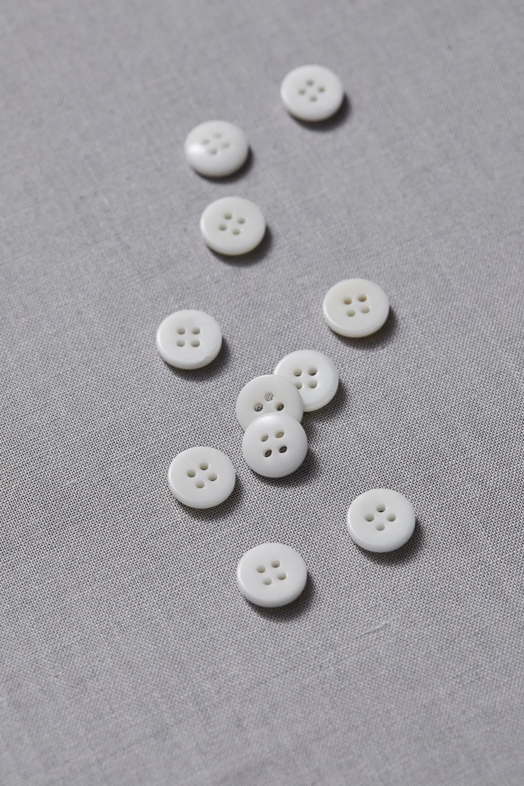 PLAIN 4 HOLE COROZO BUTTON |  Bright White 11mm